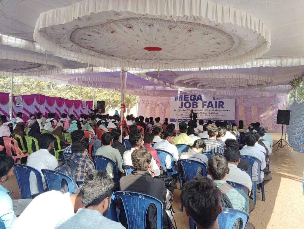 Audience seated under a tent at the Mega Job Fair in Ballari, Karnataka